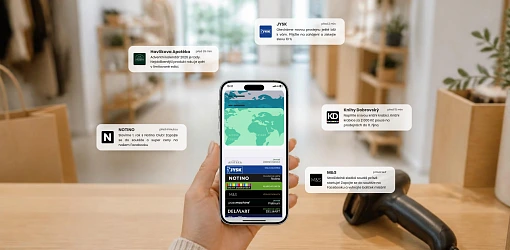 Hand holding a smartphone with digital loyalty cards in Apple Wallet against a store background with brand notifications.